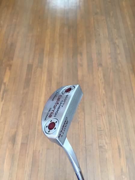Putter:  Scotty Cameron California Del Mar Although there might not much to say about a putter, this Scotty just feels right in my hands when I am putting.  The head shape is just right for my feel on the greens and the weight and lie angle are perfectly fit for my stroke. 